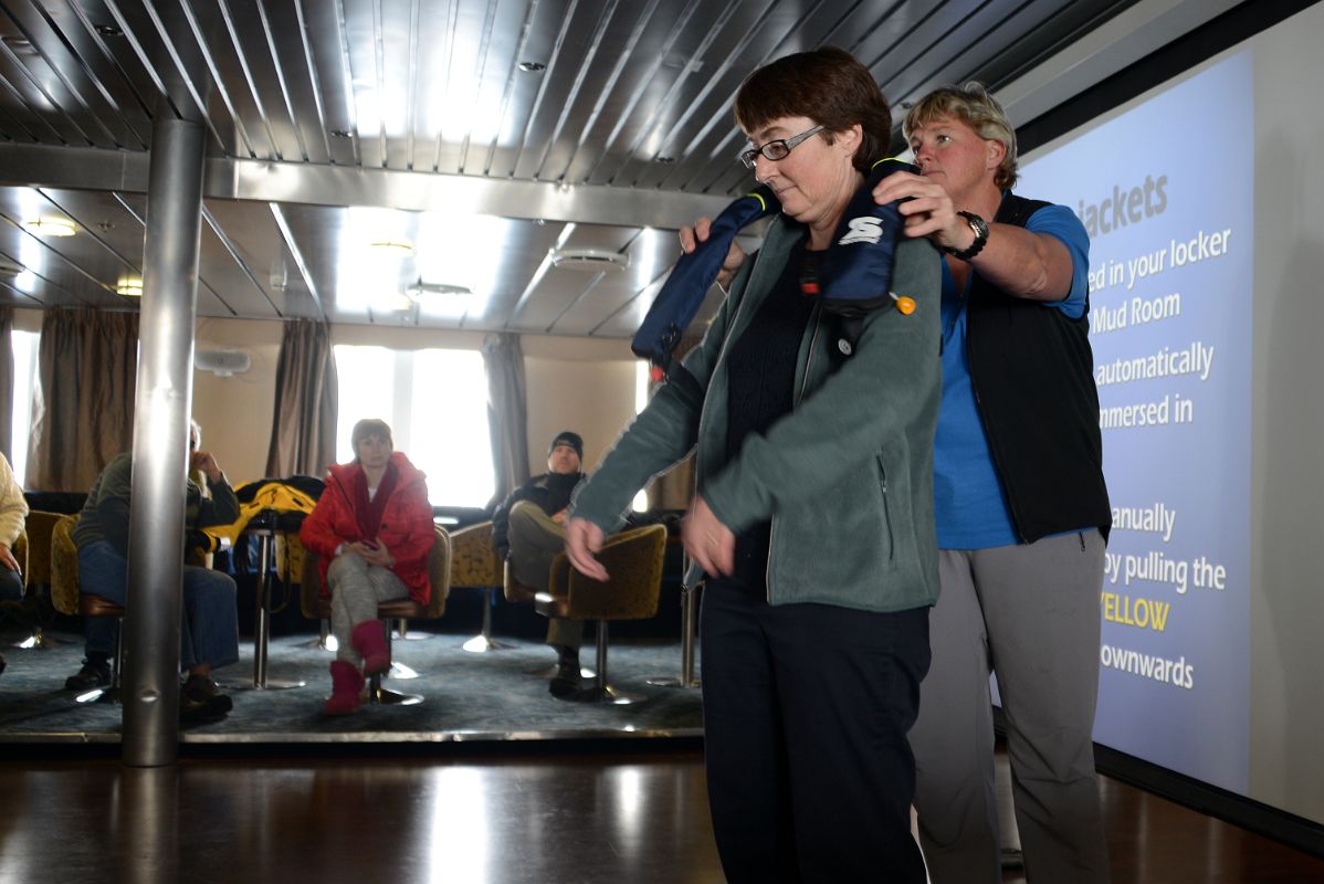 05A Charlotte Demonstrates How To Put On A Life Jacket Before We Disembark On Aitcho Barrientos Island In South Shetland Islands Quark Expeditions Antarctica Cruise Ship